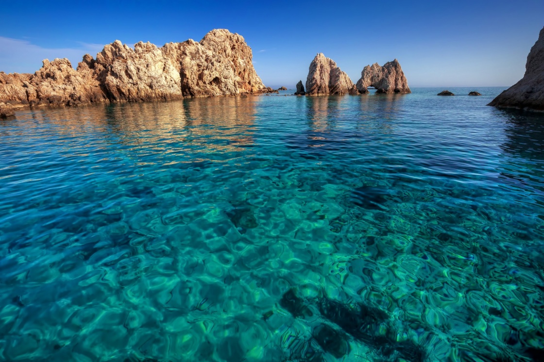 A little islet with fantastic transparent waters, Antiparos island, Cyclades, Greece